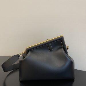 Replica Fendi First Small Black Nappa Leather Bag with metallic F-shaped clasp and detachable shoulder strap.