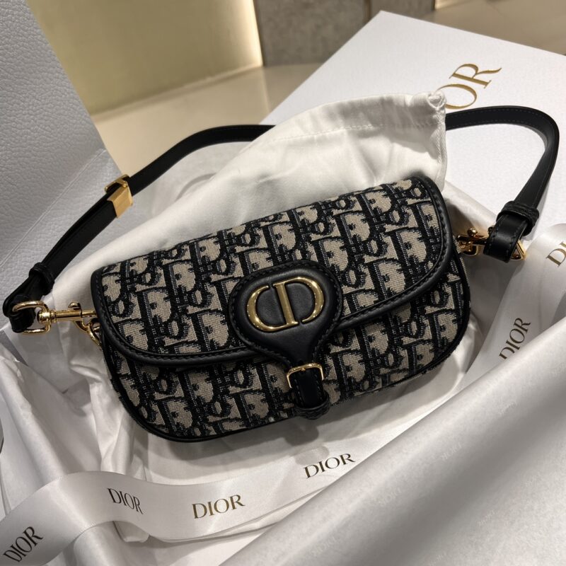 Replica Dior Bobby East-West Bag in Blue Dior Oblique Jacquard with gold-tone CD logo and adjustable shoulder strap.