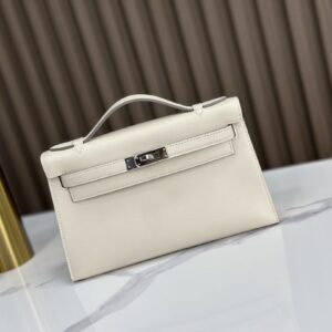 Replica HERMÈS Kelly Pochette in Craie Swift Leather – Elegant Luxury Mini Handbag