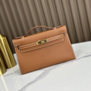 Replica HERMÈS Kelly Pochette in Gold Swift Leather – Timeless Luxury Mini Handbag