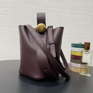 Replica Loewe Mini Pebble Bucket Bag in Dark Burgundy with premium leather and sleek design.