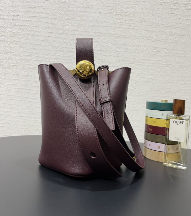 Replica Loewe Mini Pebble Bucket Bag in Dark Burgundy with premium leather and sleek design.