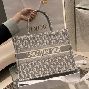 Replica Dior Medium Book Tote Ecru and Gray Dior Oblique Embroidery in premium canvas with signature Dior Oblique pattern and leather handles for a refined, luxurious look.