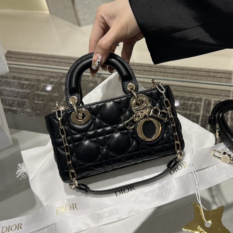 Replica Dior Lady D-Joy Micro Bag Black with signature cannage quilting, gold-tone hardware, and compact design for a sophisticated, luxurious look.